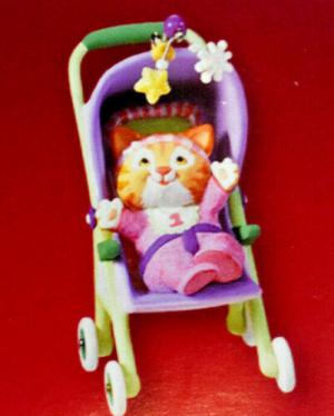 Фигурка котенок в коляске с погремушками 05г.